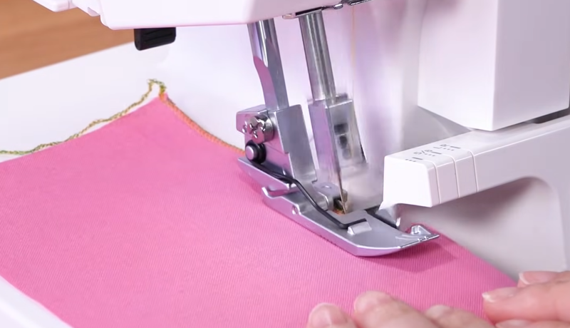 Janome SewSwitch 30 overlock presser foot for smooth fabric feeding and rolled hems