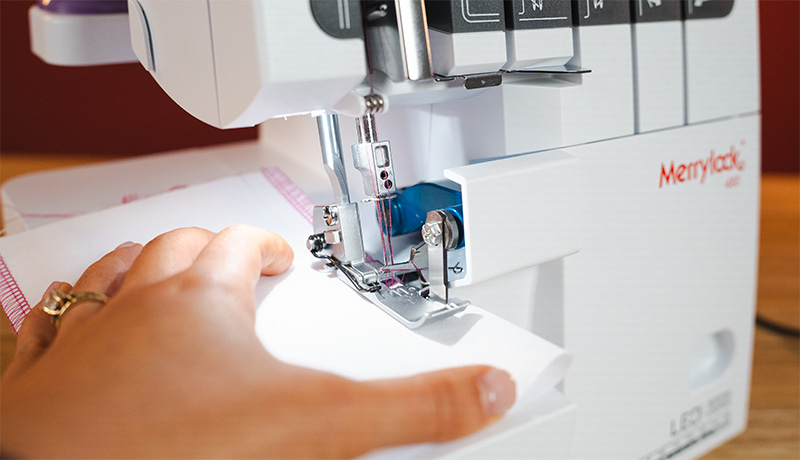 Merrylock MK480 trimming stitching and finishing a fabric edge