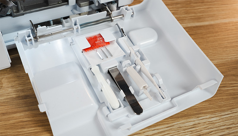 Merrylock MK480 built in accessory storage inside looper cover