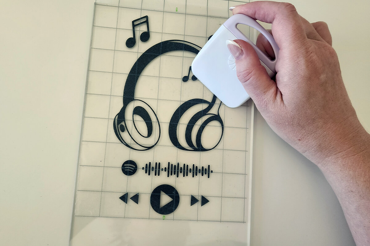 add sticker to plaque