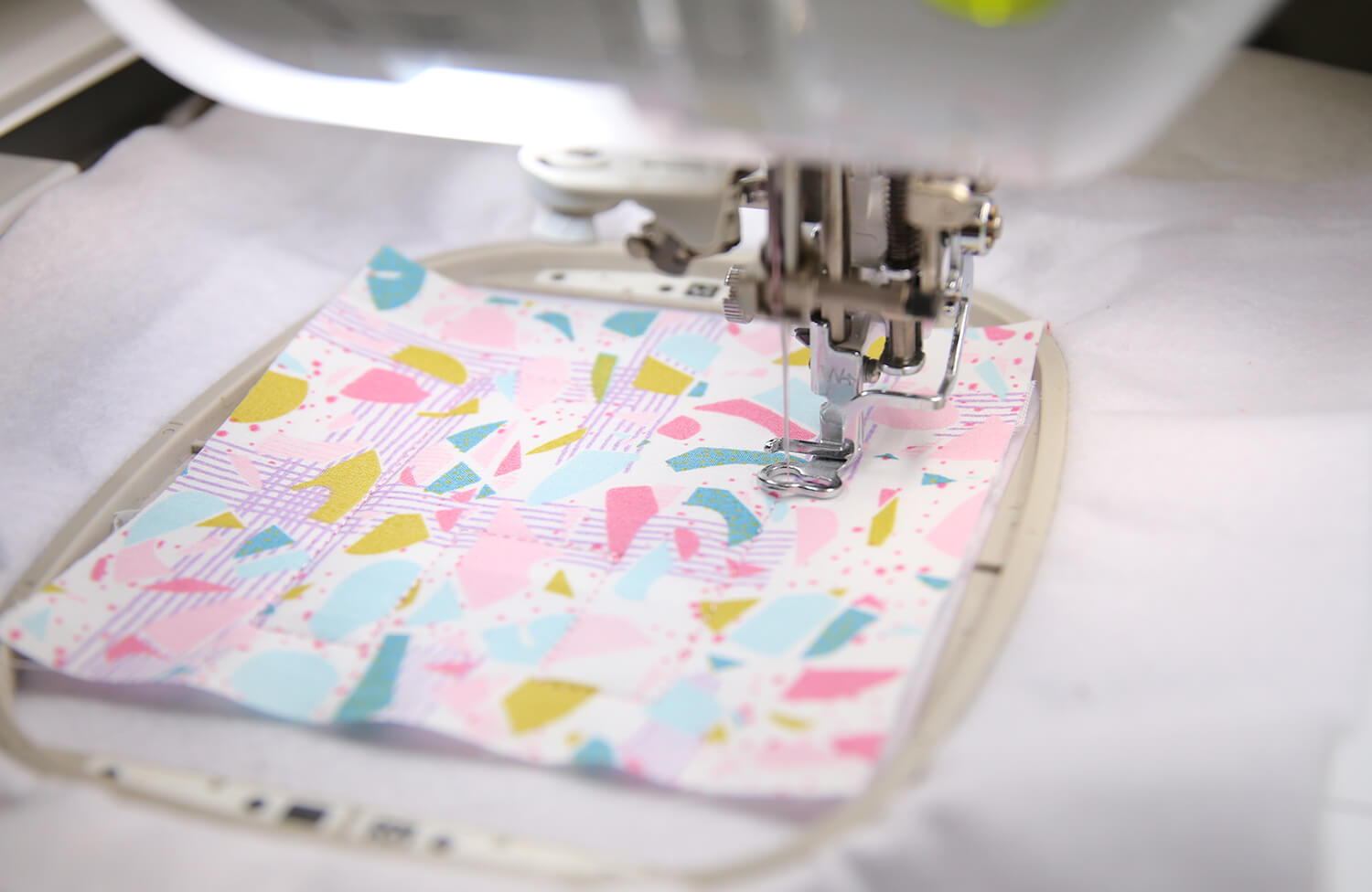 Embroidery machine stitching the applique tack-down stitch