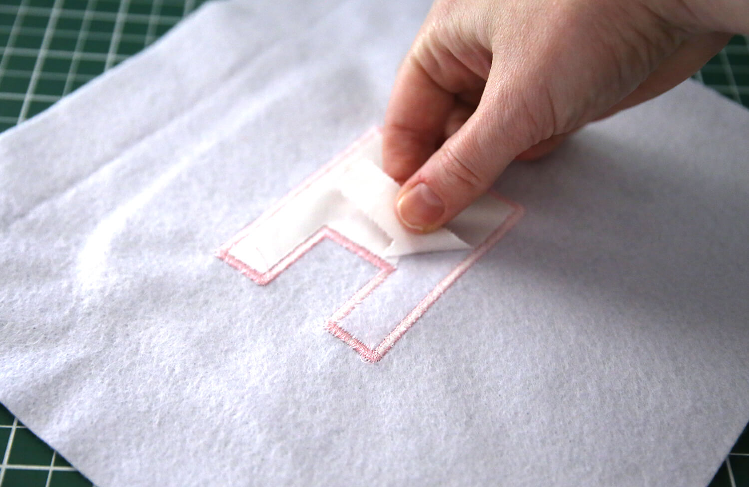Removing tearaway stabiliser from the back of embroidered felt