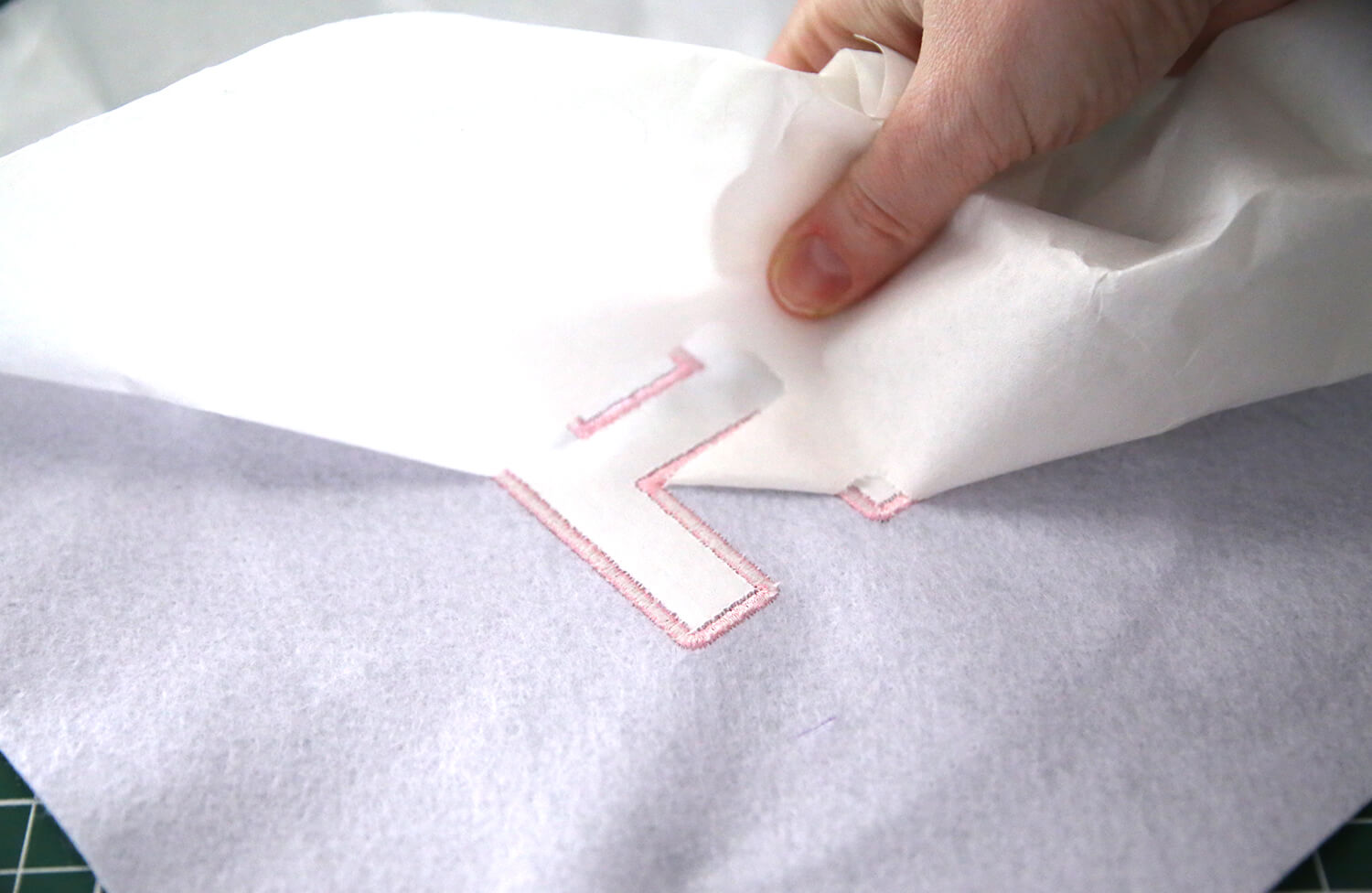 Removing tearaway stabiliser from the back of embroidered felt