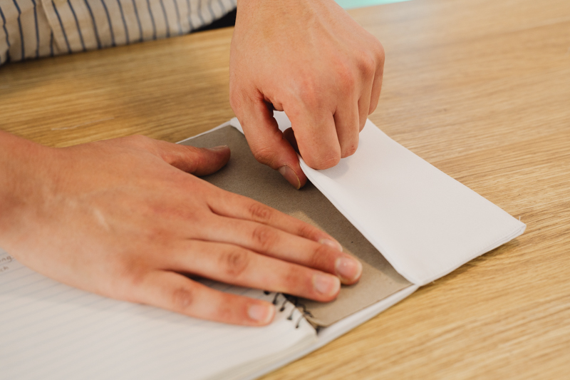 Insert book into pocket